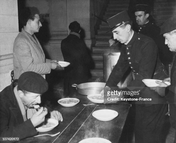 Police Officers Serving An Hot Soup To Homeless People In Paris On February 1954