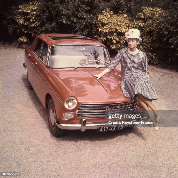 Young Woman Presenting The New Peugeot 404 In France On 1960