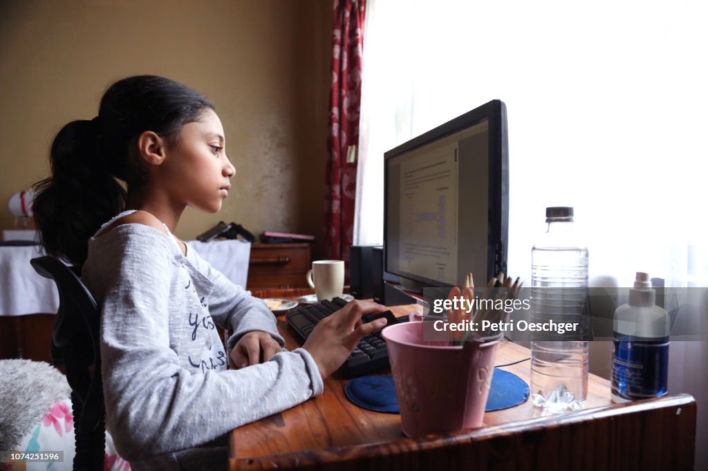 A Teenage girl doing homework.