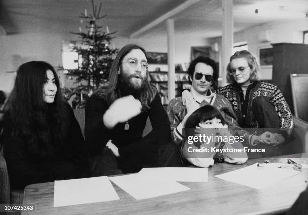 Portrait Of John Lennon And Yoko Ono With Daughter Kyoko And With Anthony Cox During A Press Conference In Denmark During Seventies