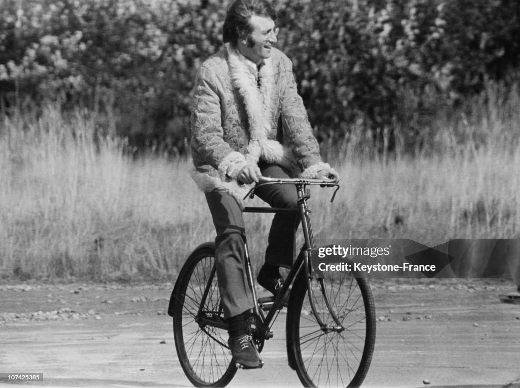 John Lennon Riding A Bicycle During Sixties