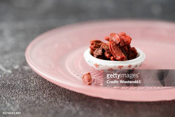 bowl of dried wolfberries - goji berry stock pictures, royalty-free photos & images