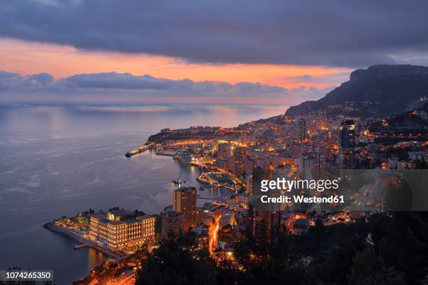 monaco, monte carlo, view to lightes city at dusk - monaco sunset stock pictures, royalty-free photos & images