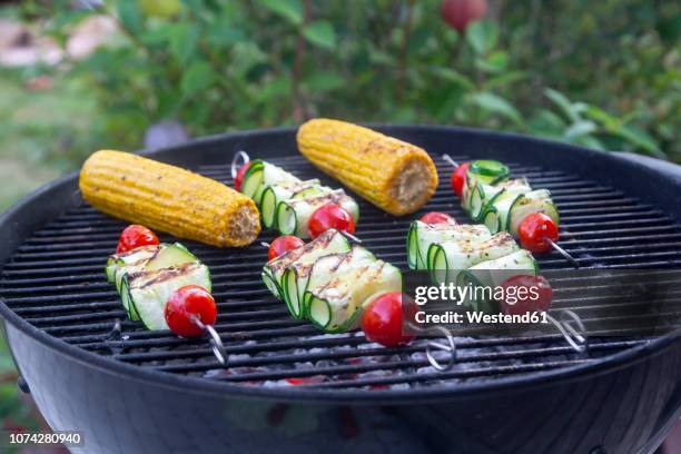 grilled vegetarian grill skewers, tomato, sheep cheese and zucchini slices, corn cobs on grill - grilled vegetables stock pictures, royalty-free photos & images