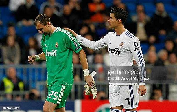 Cristiano Ronaldo of Real Madrid comforts Jerzy Dudek as he leaves the field injured during the Champions League group G match between Real Madrid...