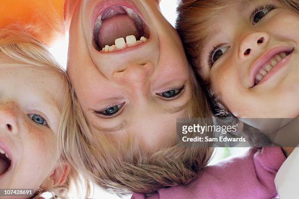 close up of children smiling - solo bambini foto e immagini stock