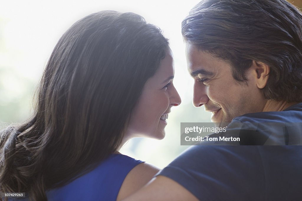 Couple smiling at one another