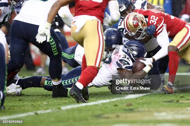 Chris Carson of the Seattle Seahawks dives for a touchdown against the San Francisco 49ers during their NFL game at Levi's Stadium on December 16,...