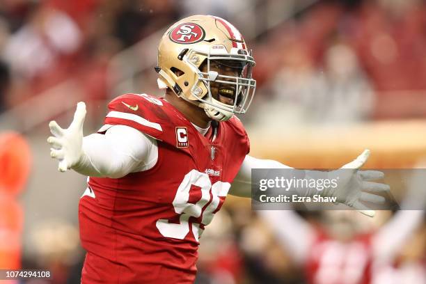 DeForest Buckner of the San Francisco 49ers celebrates after a sack of Russell Wilson of the Seattle Seahawks during their NFL game at Levi's Stadium...