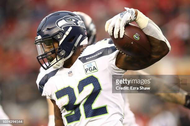 Chris Carson of the Seattle Seahawks rushes with the ball against the San Francisco 49ers during their NFL game at Levi's Stadium on December 16,...