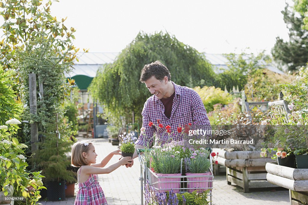 Father and daughter shopping together in nursery