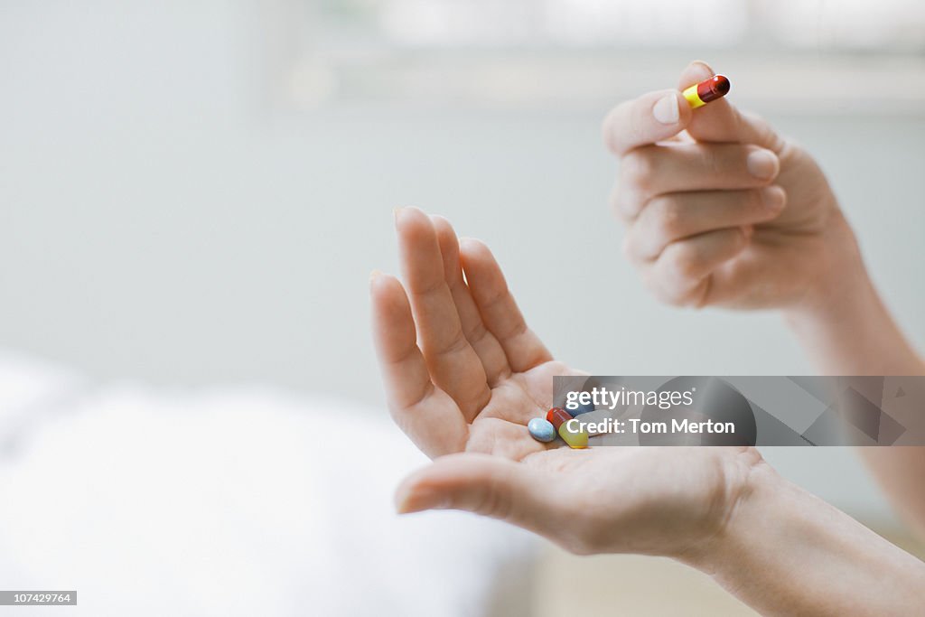 Woman taking vitamins and supplements