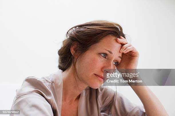 depressed woman with head in hands - depression sadness stock pictures, royalty-free photos & images