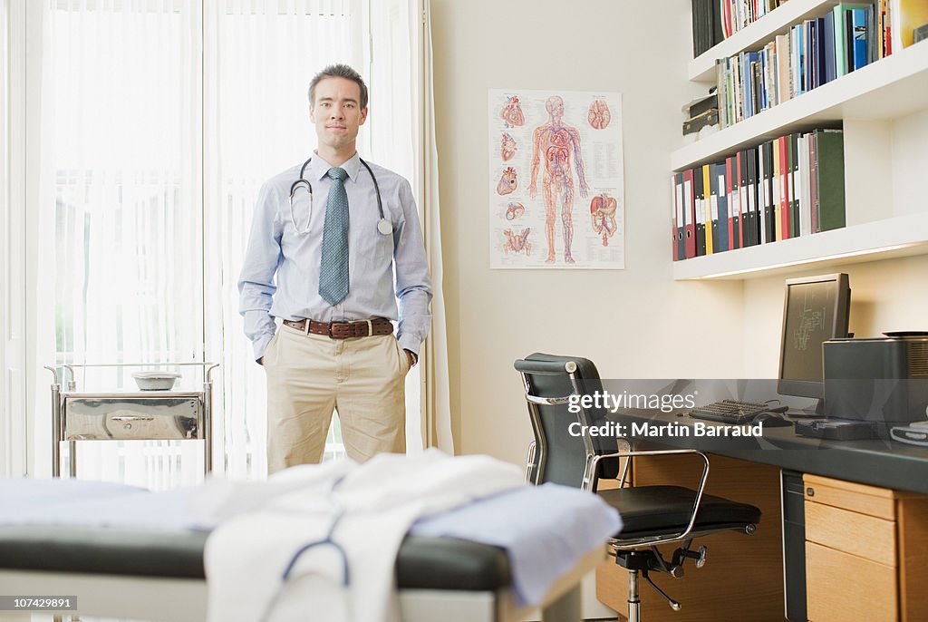 Doctor standing in doctors office