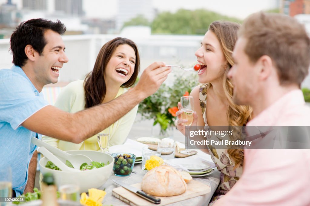 Couples enjoying party on balcony