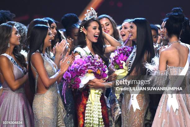Catriona Gray of the Philippines is congratulated by contestants after winning the Miss Universe 2018 on December 17, 2018 in Bangkok.