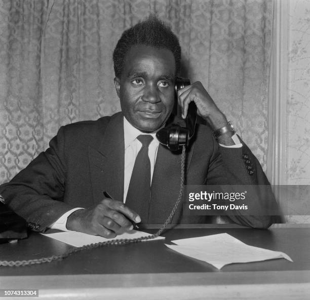 Zambian politician Kenneth Kaunda using a phone, UK, 23rd June 1961.