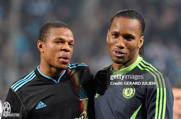 Marseille's forward Loic Remy chats with Chelsea's forward Didier Drogba after the UEFA Champions League Group F football match Marseille vs Chelsea,...