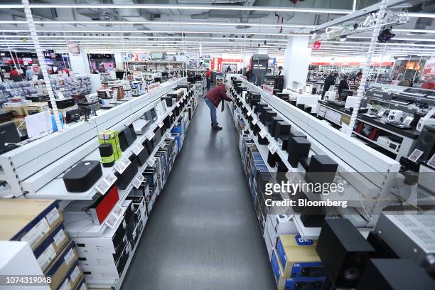 Customer browses hi-fi stereo systems inside a Media Markt electronic goods store, operated by Ceconomy AG, in Berlin, Germany, on Monday, Dec. 17,...