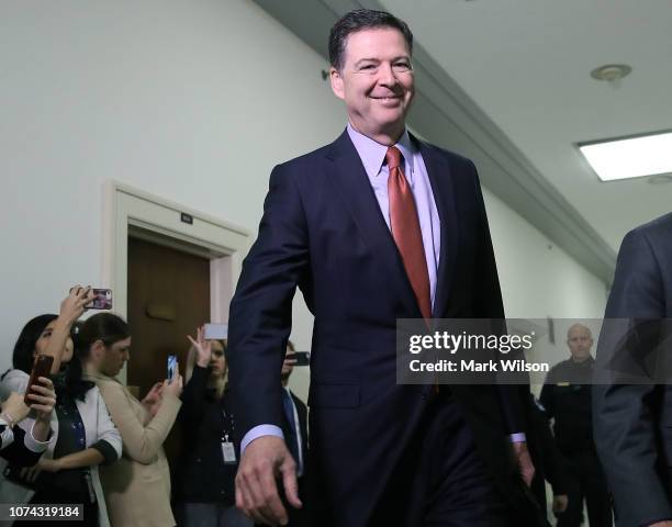 Former Federal Bureau of Investigation Director James Comey arrives at the Rayburn House Office Building before testifying to the House Judiciary and...