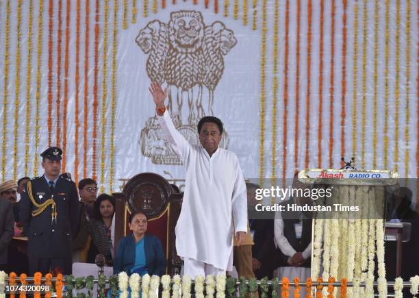 Madhya Pradesh Chief Minister Kamal Nath waves after taking oath of office at Jamboree Ground on December 17, 2018 in Bhopal, India. The 72-year-old...
