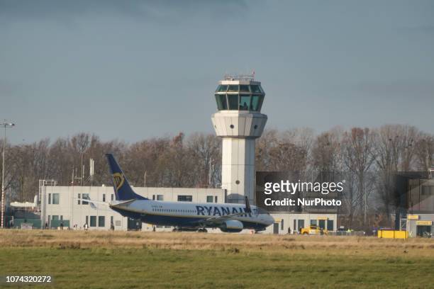 Ryanair low cost carrier Boeing 737-800 or 737-8AS with registration EI-EKL seen in Maastricht Aachen Airport MST / EHBK with the terminal building...