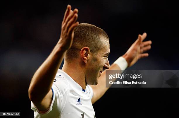 Karim Benzema of Real Madrid celebrates his third goal during the UEFA Champions League Group G match between Real Madrid and AJ Auxerre at Estadio...