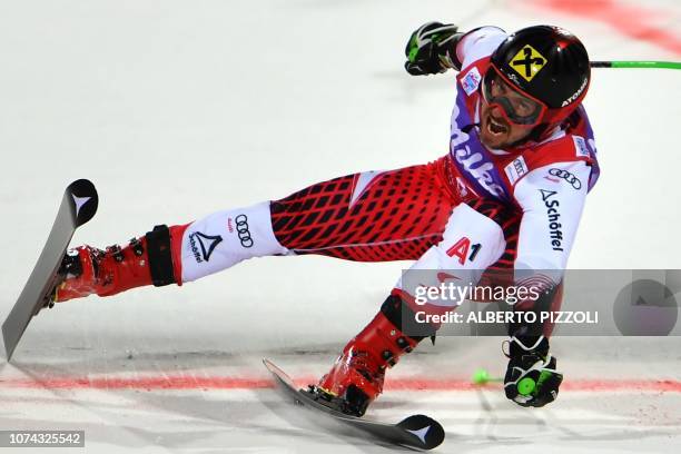 Austria's Marcel Hirscher crosses the finish line to win the FIS Alpine World Cup Men's Parallel Giant Slalom nightrace on December 17, 2018 in Alta...