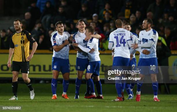Connor Jennings of Tranmere celebrates with teammates after scoring his sides second goal during the FA Cup Second Round Replay match between...
