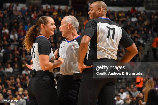 Referees Ashley Moyer-Gleich, Jason Phillips, and Karl Lane talk during the game between the Los Angeles Lakers and the San Antonio Spurs on December...