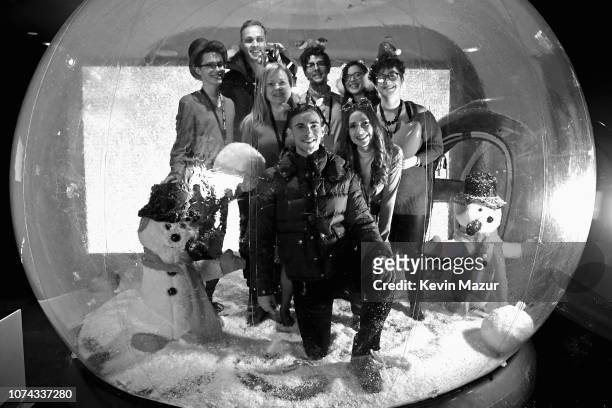 Adam Rippon poses inside a snowglobe during Full Frontal With Samantha Bee Presents Christmas On I.C.E. At PlayStation Theater on December 17, 2018...