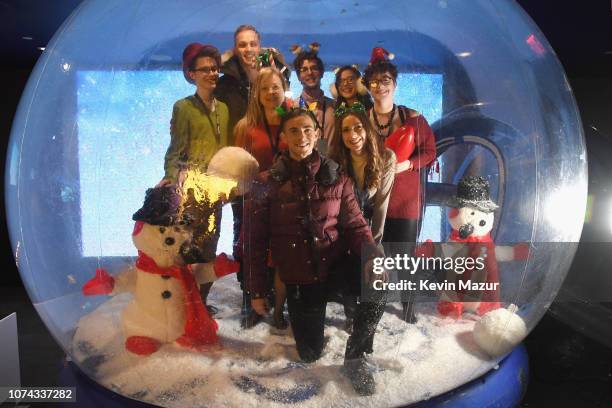 Adam Rippon poses inside a snowglobe during Full Frontal With Samantha Bee Presents Christmas On I.C.E. At PlayStation Theater on December 17, 2018...