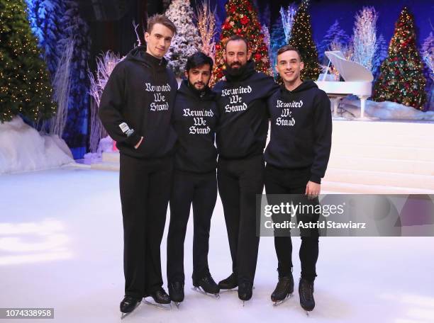 Adam Rippon poses with the Abolish I.C.E. Skaters in the The Full Frontal x Opening Ceremony collaboration collection hoodie during Full Frontal With...