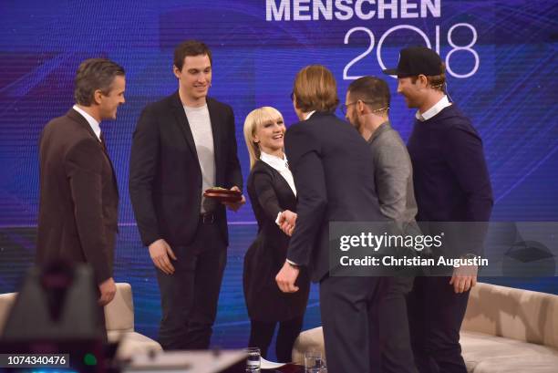 Markus Lanz, Bruno Massot, Aljona Savchenko, Christian Ehrhoff, Danny aus den Birken and Yannic Seidenberg are seen on stage during the TV show...