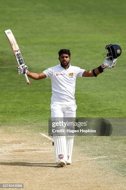 Kusal Mendis of Sri Lanka celebrates his century during day four of the First Test match in the series between New Zealand and Sri Lanka at Basin...