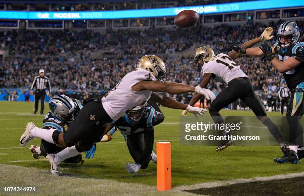 Tommylee Lewis of the New Orleans Saints fumbles against the Carolina Panthers in the fourth quarter during their game at Bank of America Stadium on...