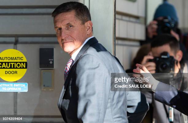Former US National Security Advisor General Michael Flynn arrives for his sentencing hearing at US District Court in Washington, DC on December 18,...