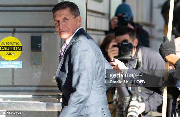 Former US National Security Advisor General Michael Flynn arrives for his sentencing hearing at US District Court in Washington, DC on December 18,...