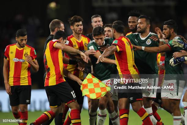Players of ES Tunis and CD Guadalajara reacts after Anice Badri of Esperance de Tunis receives a red card during the FIFA Club World Cup UAE 2018 5th...