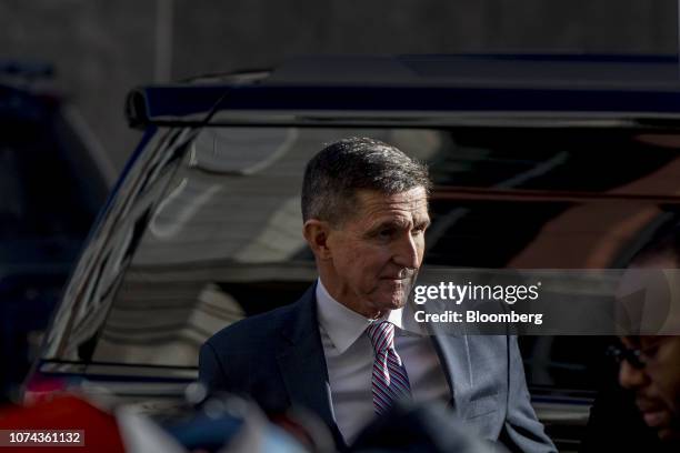 Michael Flynn, former U.S. National security adviser, center, arrives at federal court in Washington, D.C., U.S., on Tuesday, Dec. 18, 2018....