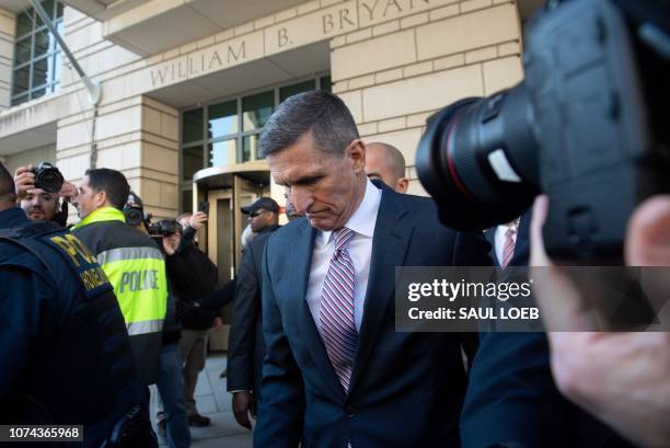 Former National Security Advisor General Michael Flynn leaves after the delay in his sentencing hearing at US District Court in Washington, DC,...