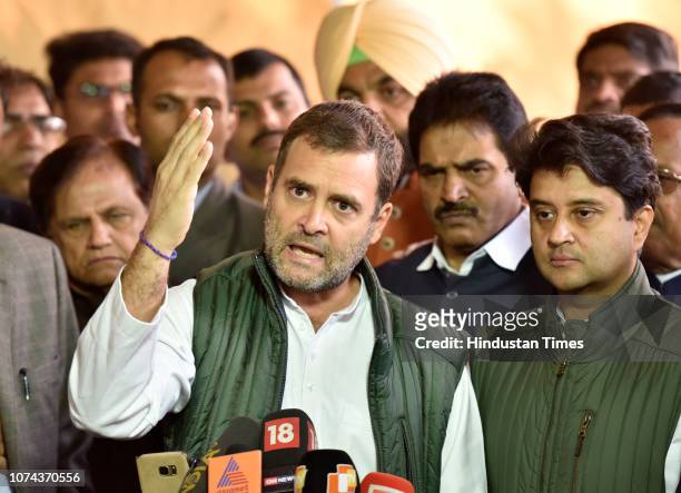 Congress President Rahul Gandhi addresses the media as party MP Jyotiraditya Scindia looks on during the winter session in Parliament, on December...