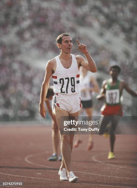 Steve Ovett of Great Britain signals 'ILY' I Love You to his girlfriend Rachel Waller after winning the Men's 800m race on 26th July 1980 at the XXII...