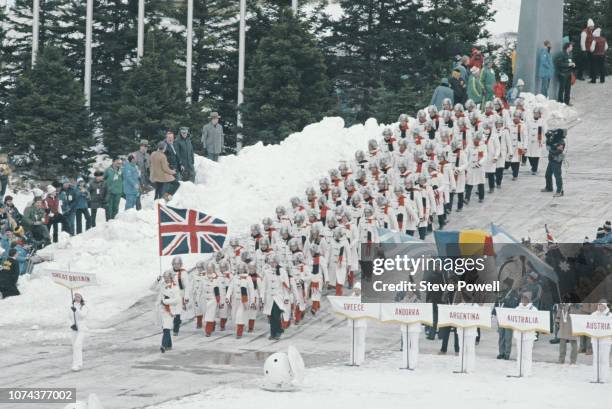 Alpine skier and luger Jeremy Palmer-Tomkinson carries the Union flag ahead of the British team at the Opening Ceremony for the XIII Olympic Winter...