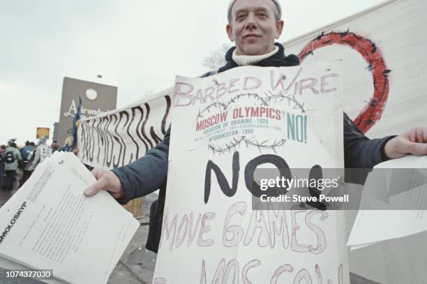 Protester against the Moscow summer Olympics boycott during the Opening Ceremony for the XIII Olympic Winter Games on 14 February 1980 at the Lake...