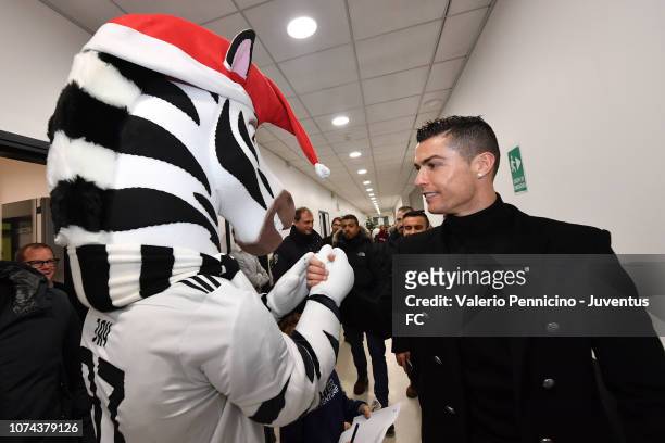 Cristiano Ronaldo salutes Jay during a visit to the Juventus youth sector on December 18, 2018 in Turin, Italy.