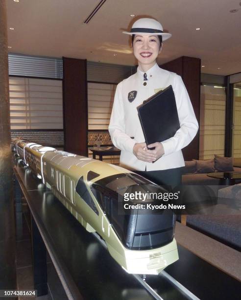 Photo taken at JR Tokyo Station on Aug. 7 shows Michiko Ozawa, a train crew instructor for East Japan Railway Co.'s Train Suite Shiki-shima luxury...