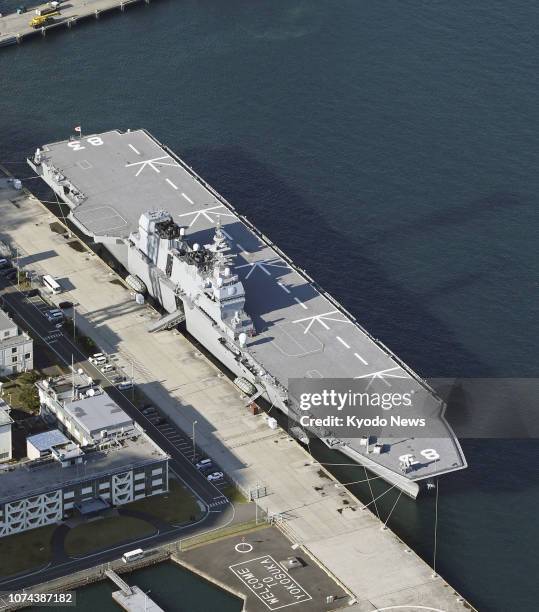 Photo taken from a Kyodo News helicopter on Dec. 18 shows the helicopter carrier Izumo anchored at the Japanese Maritime Self-Defense Force's...