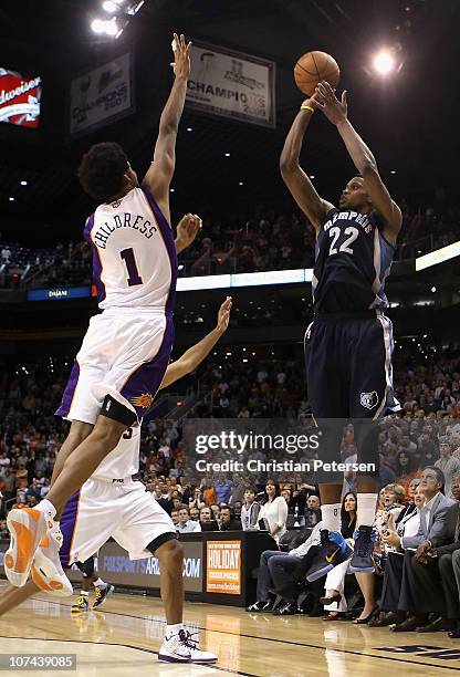 Rudy Gay of the Memphis Grizzlies puts up the game tying three point shot over Josh Childress of the Phoenix Suns at the end of regulation in the NBA...