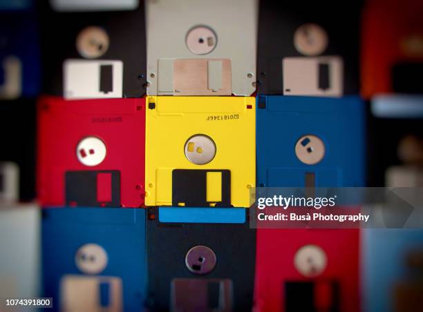 background made of vintage colored floppy disks - datenspeicher diskette stock-fotos und bilder